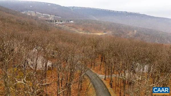 a view of mountain view with lots of trees