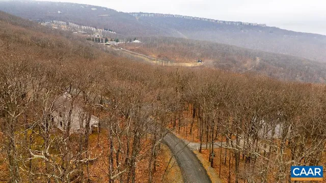 a view of mountain view with lots of trees