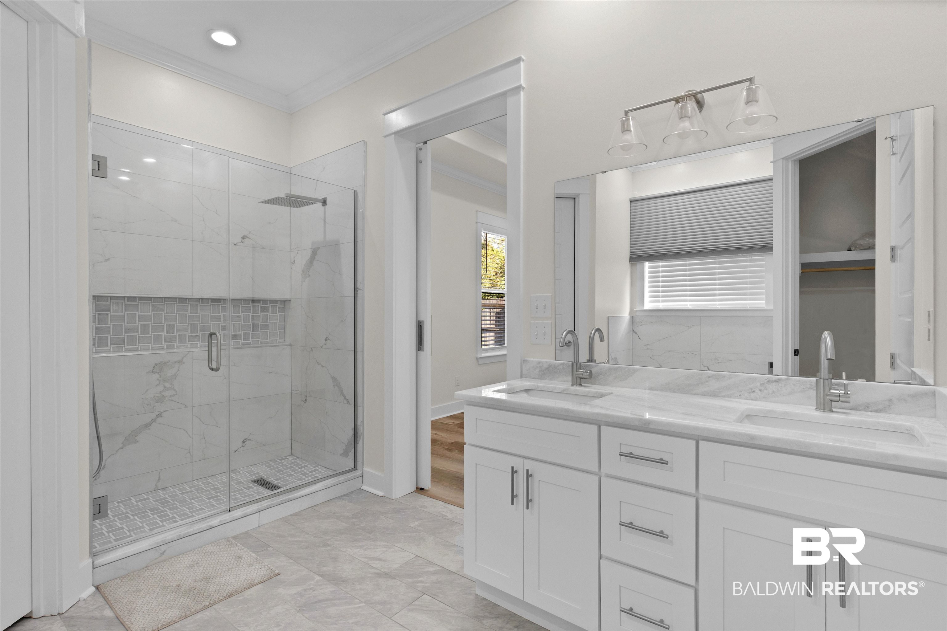 8069 Carmel Circle Foley, AL 36535 - Photo 18 of 23 Full bath with a marble finish shower, double vanity, ornamental molding, and a sink