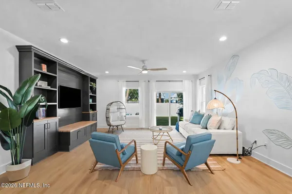 a backyard of a house with table and chairs