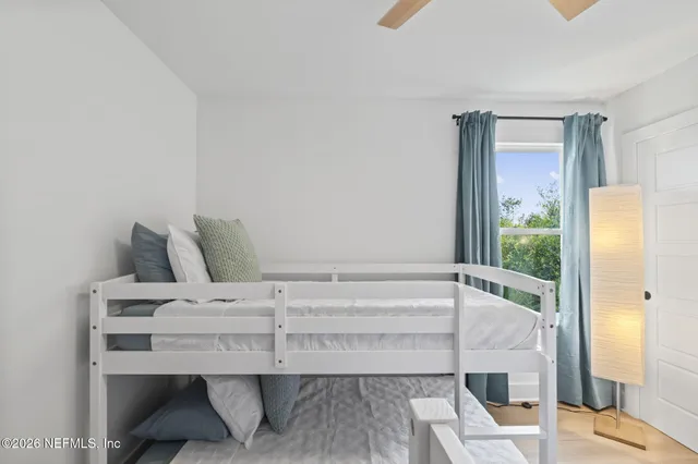 a bathroom with a toilet a sink a mirror and vanity