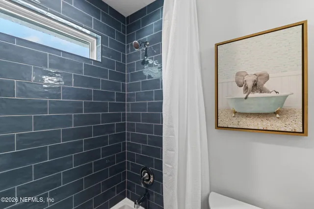 a living room with furniture and flat screen tv