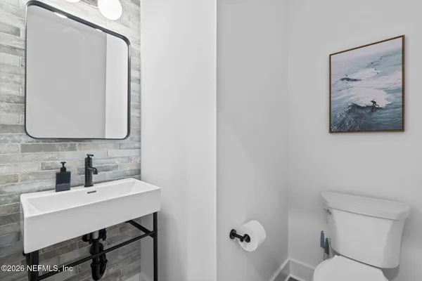 a bedroom with a large bed and a large window