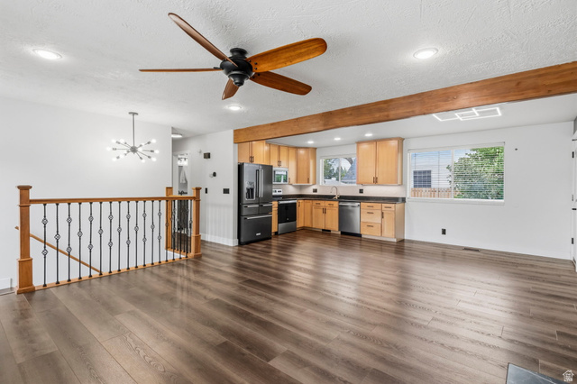 2693 Teal Way Sandy, UT 84093 - Photo 5 of 50 Open-concept living space featuring wood-finish flooring, a modern ceiling fan, and recessed lighting