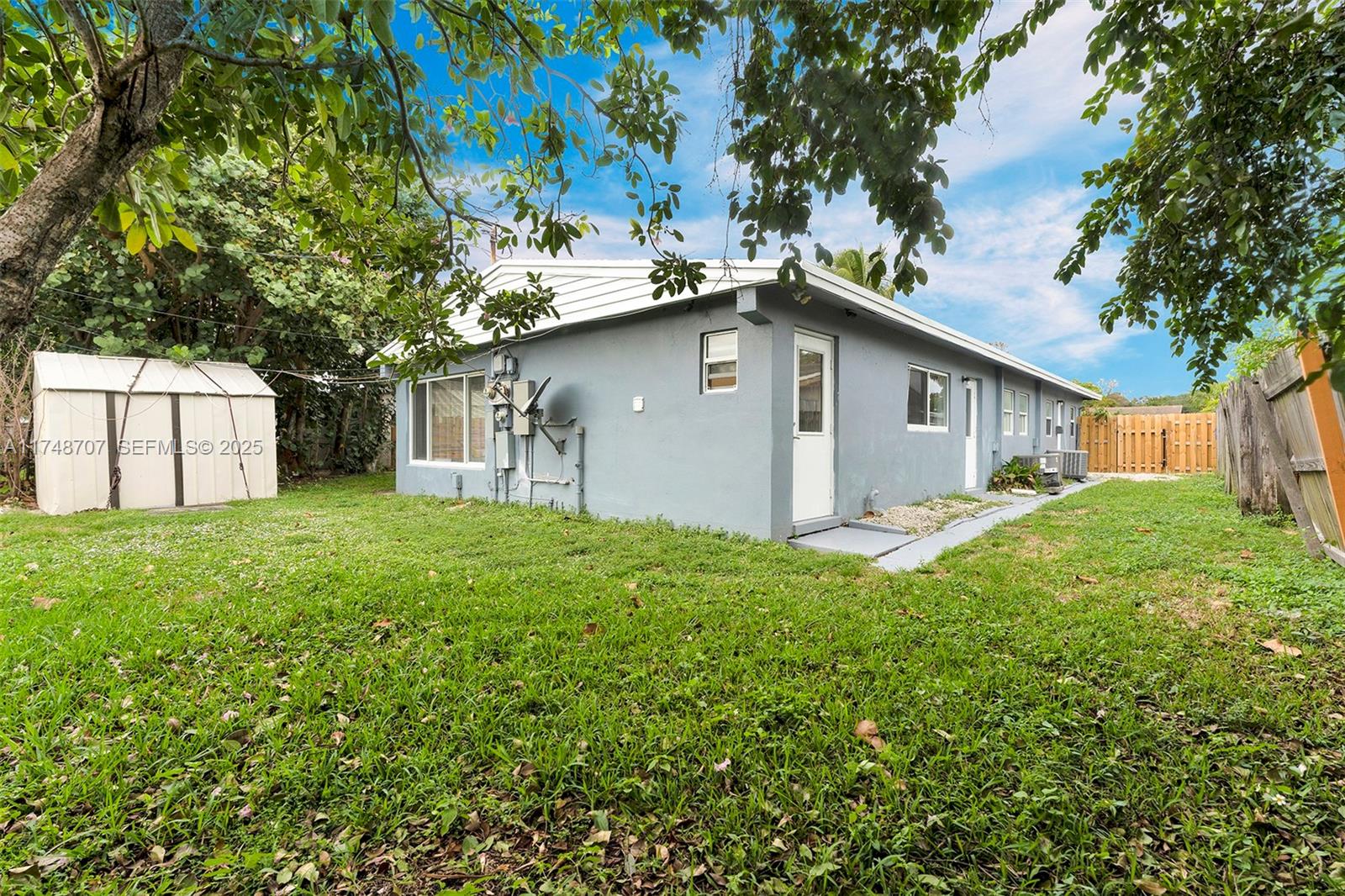 1120 Southwest 30th Street, Unit A Fort Lauderdale, FL 33315 - Photo 20 of 29 a white house that has a tree in front of it
