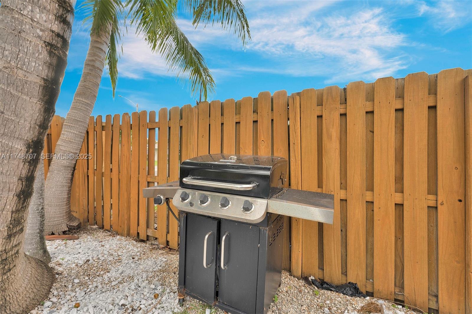 1120 Southwest 30th Street, Unit A Fort Lauderdale, FL 33315 - Photo 26 of 29 a view of a backyard with wooden fence