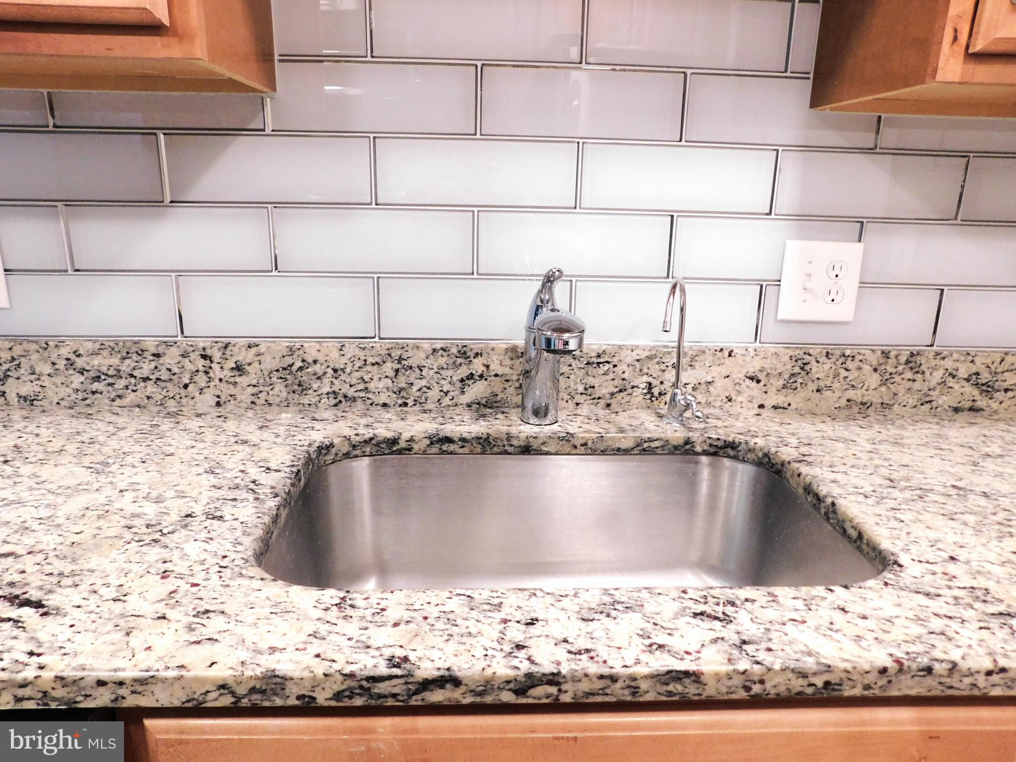 11601 Stoneview Square, Unit 11C Reston, VA 20191 - Photo 14 of 37 Newer pull-out chrome faucet
& water filter tap
