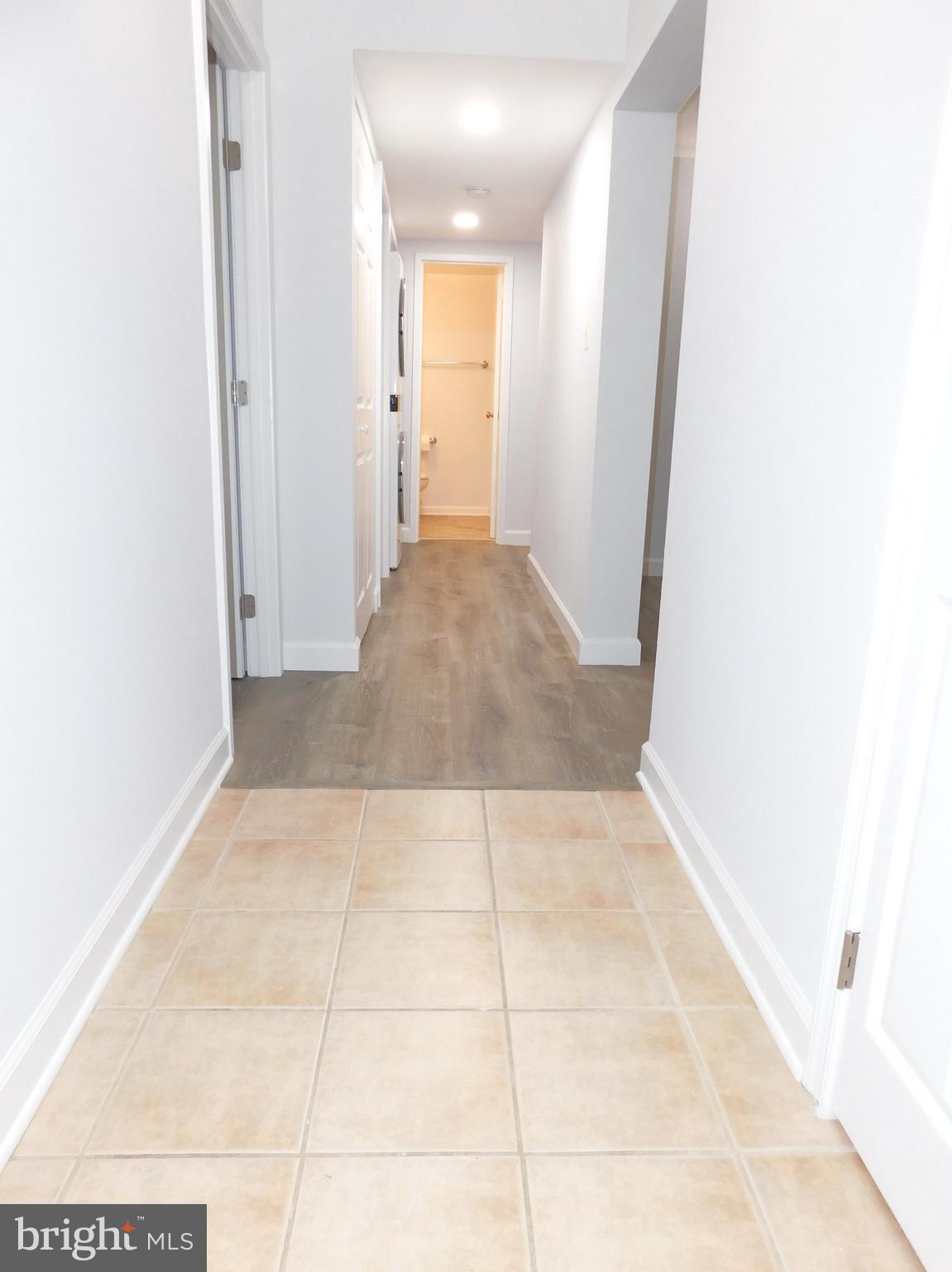 11601 Stoneview Square, Unit 11C Reston, VA 20191 - Photo 16 of 37 From foyer to FBA: newer recessed lites & sconces