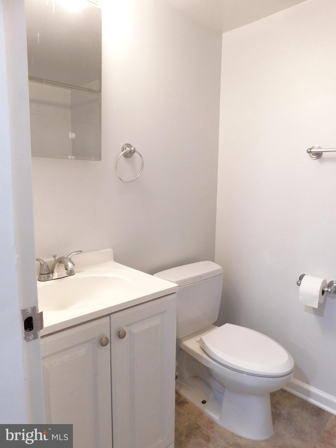 11601 Stoneview Square, Unit 11C Reston, VA 20191 - Photo 29 of 37 Hallway FBA: 12" tile floor, newer door, vanity+