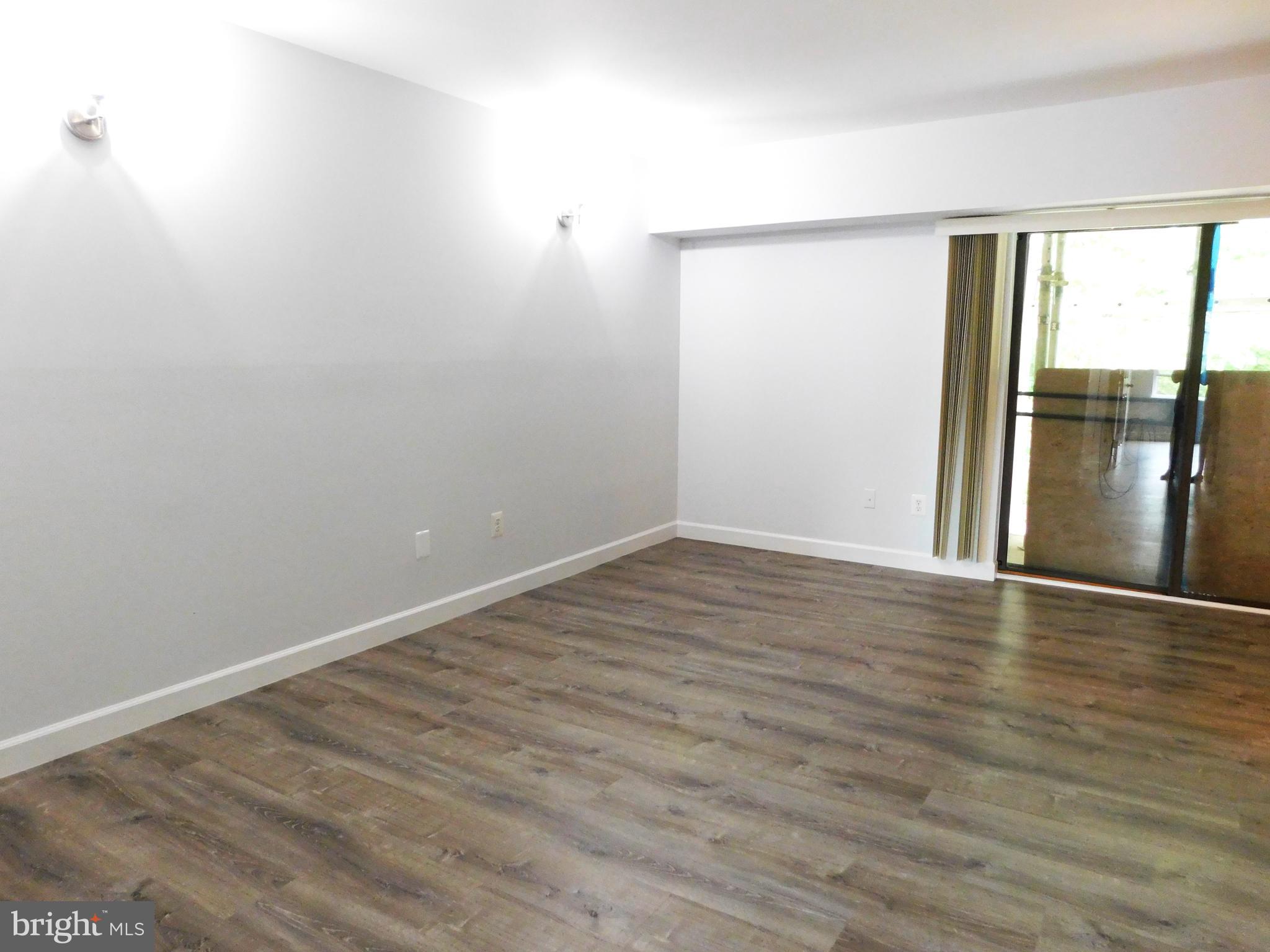 11601 Stoneview Square, Unit 11C Reston, VA 20191 - Photo 3 of 37 Remodeled LR with Luxry Vinyl Plank flooring