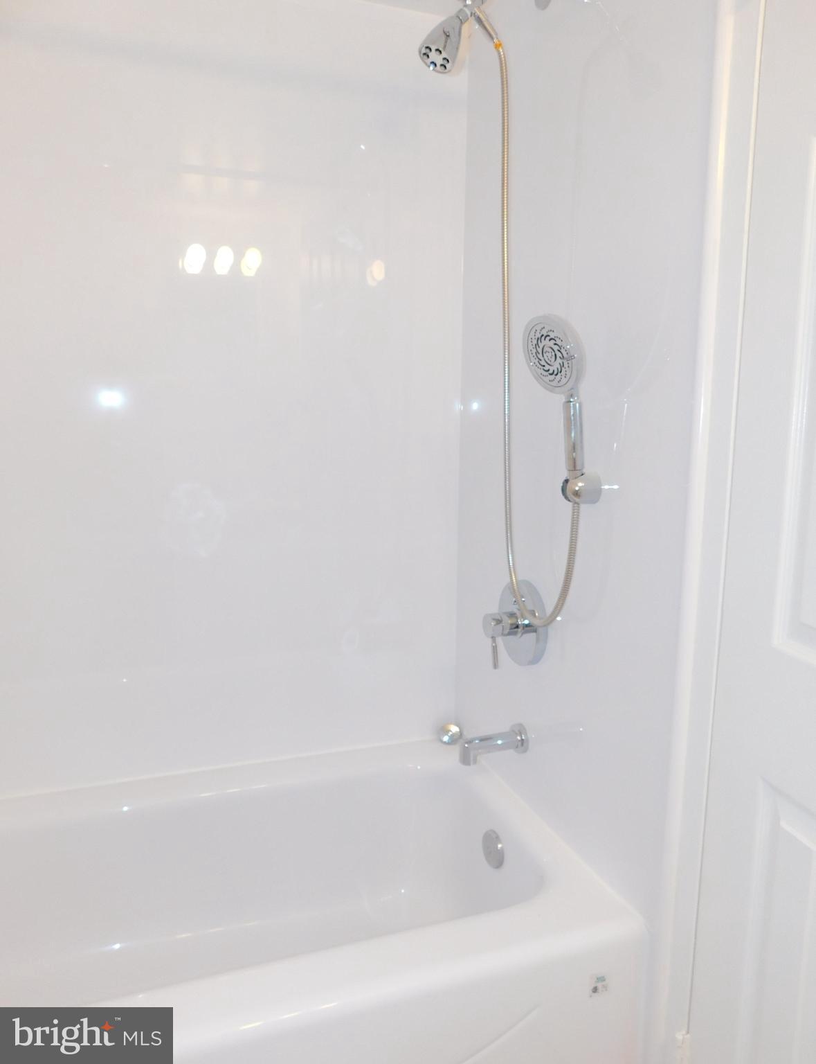 11601 Stoneview Square, Unit 11C Reston, VA 20191 - Photo 31 of 37 Newer shower head added to custom tub-shower