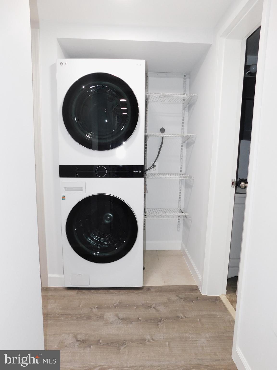 11601 Stoneview Square, Unit 11C Reston, VA 20191 - Photo 33 of 37 Dryer vent is now hidden, leaving room for shelves