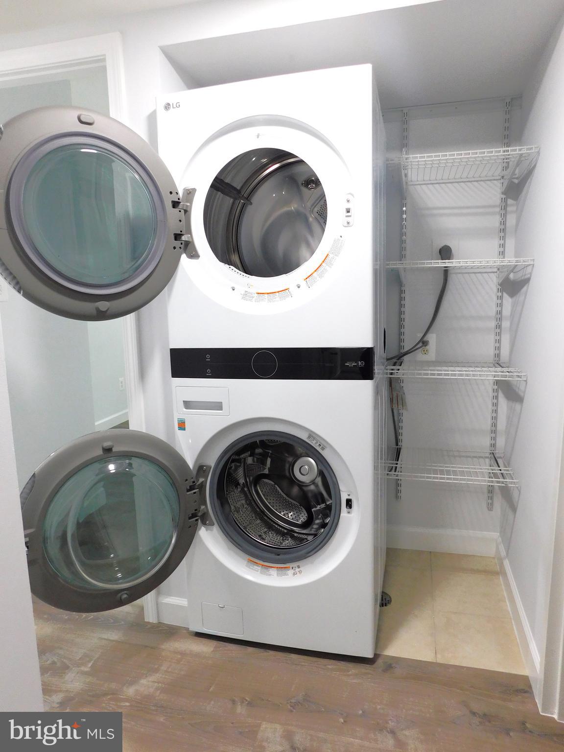 11601 Stoneview Square, Unit 11C Reston, VA 20191 - Photo 34 of 37 SS interior of LG Washer-Dryer & added shelving