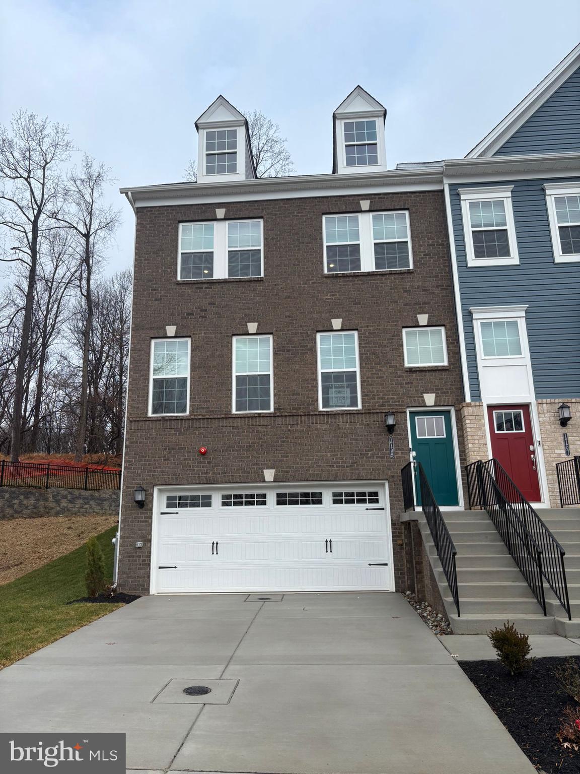 1759 Water Xing Road Baltimore, MD 21208 - Photo 1 of 15 a front view of a house with a yard