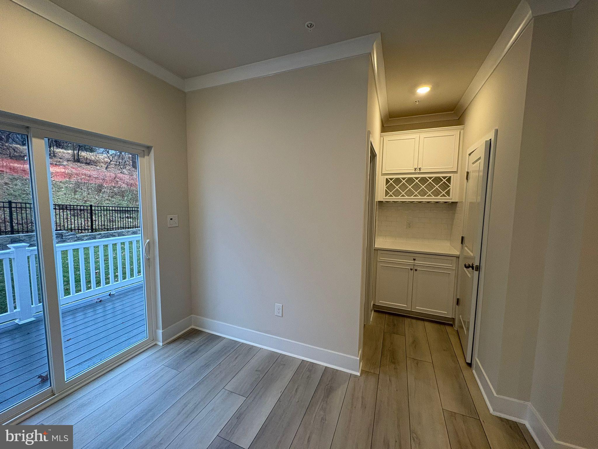 1759 Water Xing Road Baltimore, MD 21208 - Photo 5 of 15 wooden floor in an empty room with a window