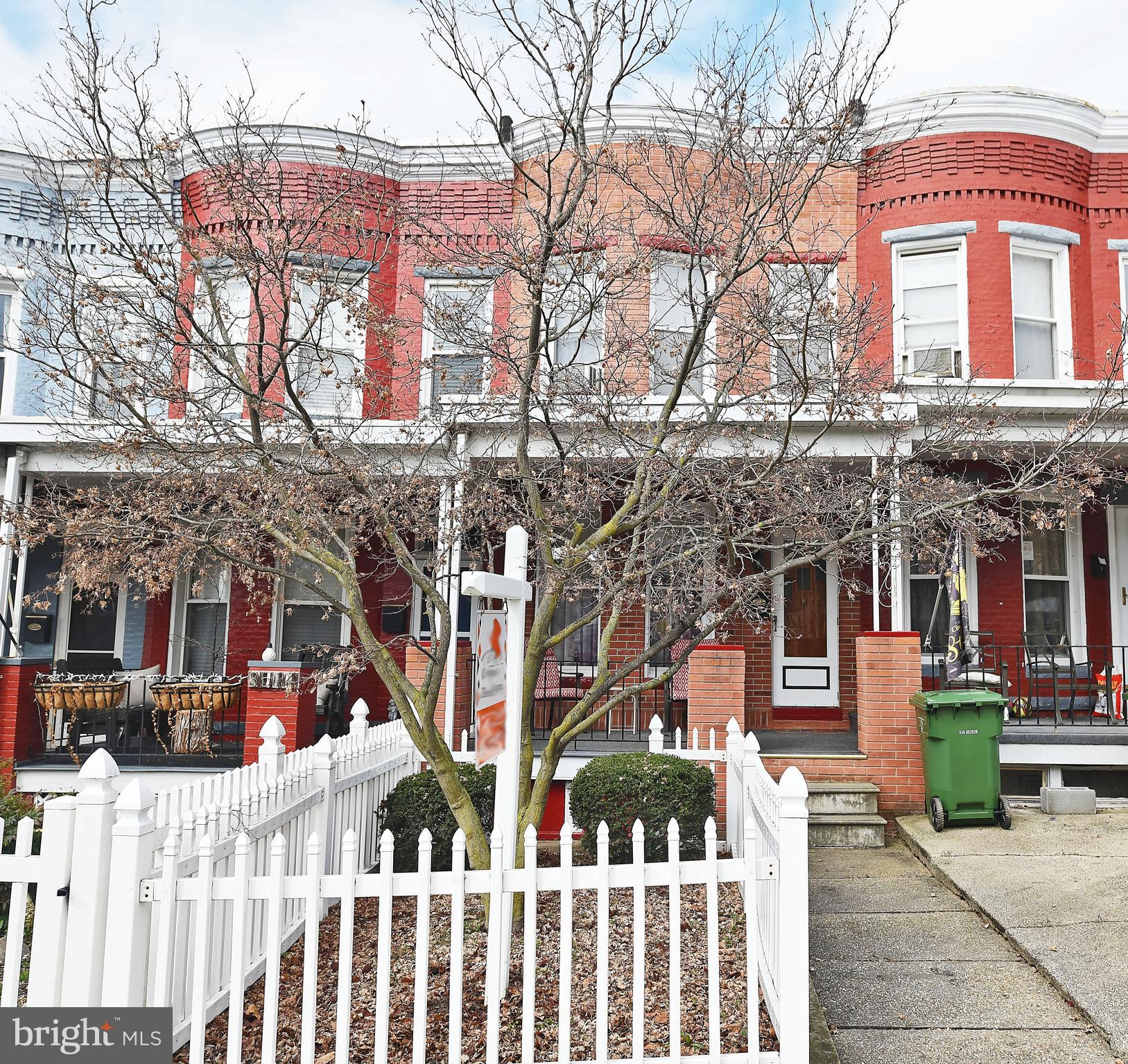 3516 Roland Avenue Baltimore, MD 21211 - Photo 2 of 23 Beautiful brick porch front with picket fence!