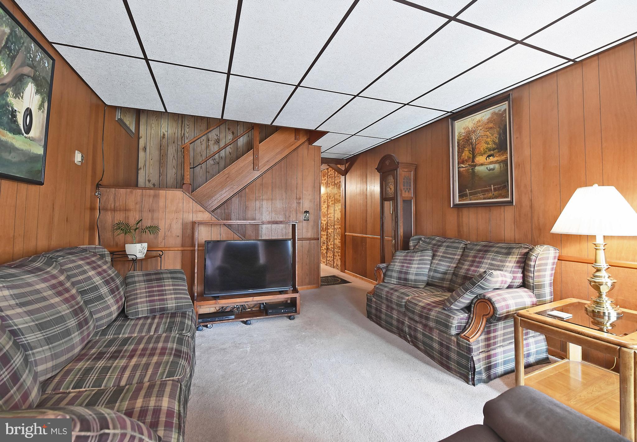 3516 Roland Avenue Baltimore, MD 21211 - Photo 8 of 23 Living room with open staircase to upper level!