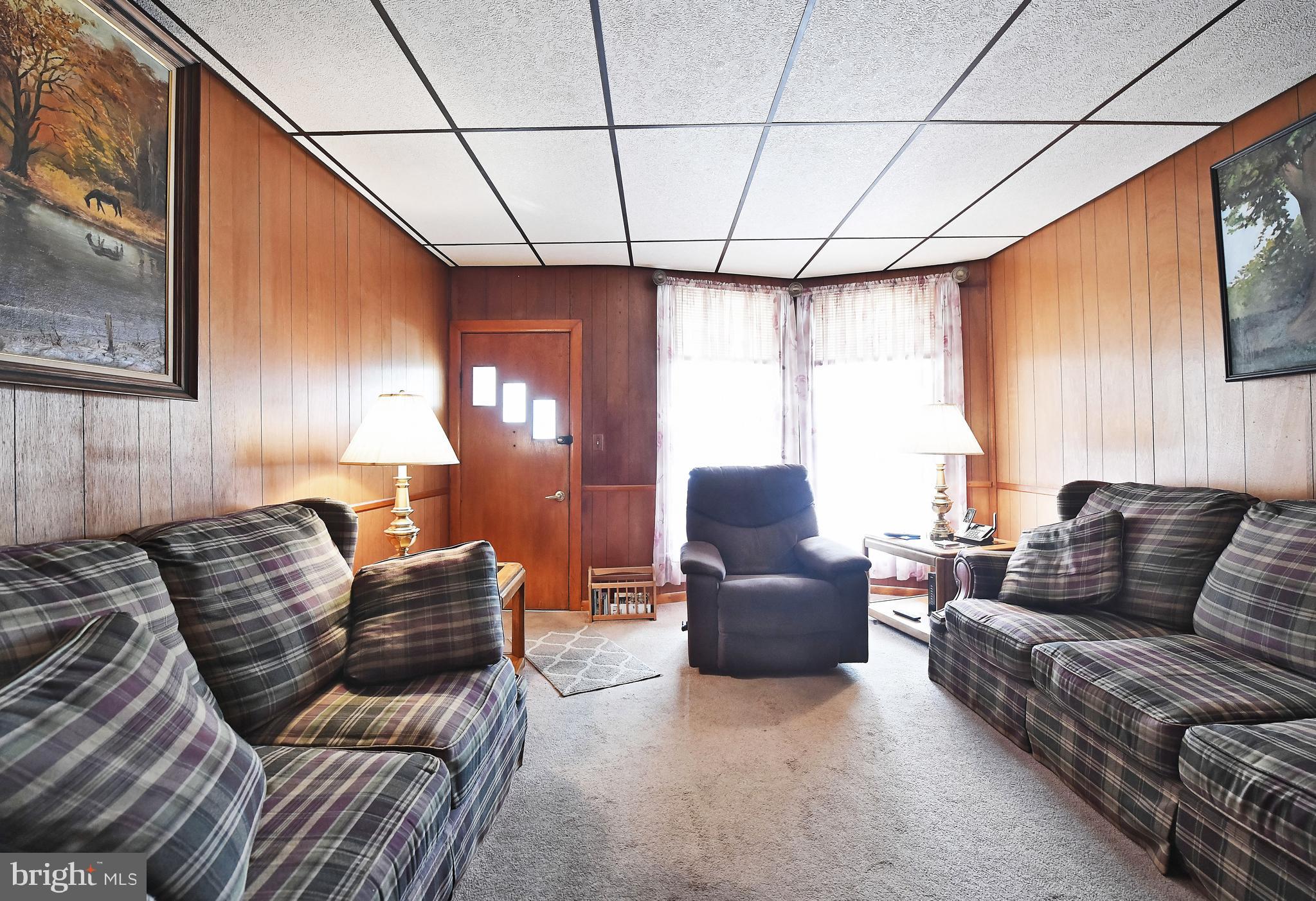 3516 Roland Avenue Baltimore, MD 21211 - Photo 9 of 23 Living room with large windows.