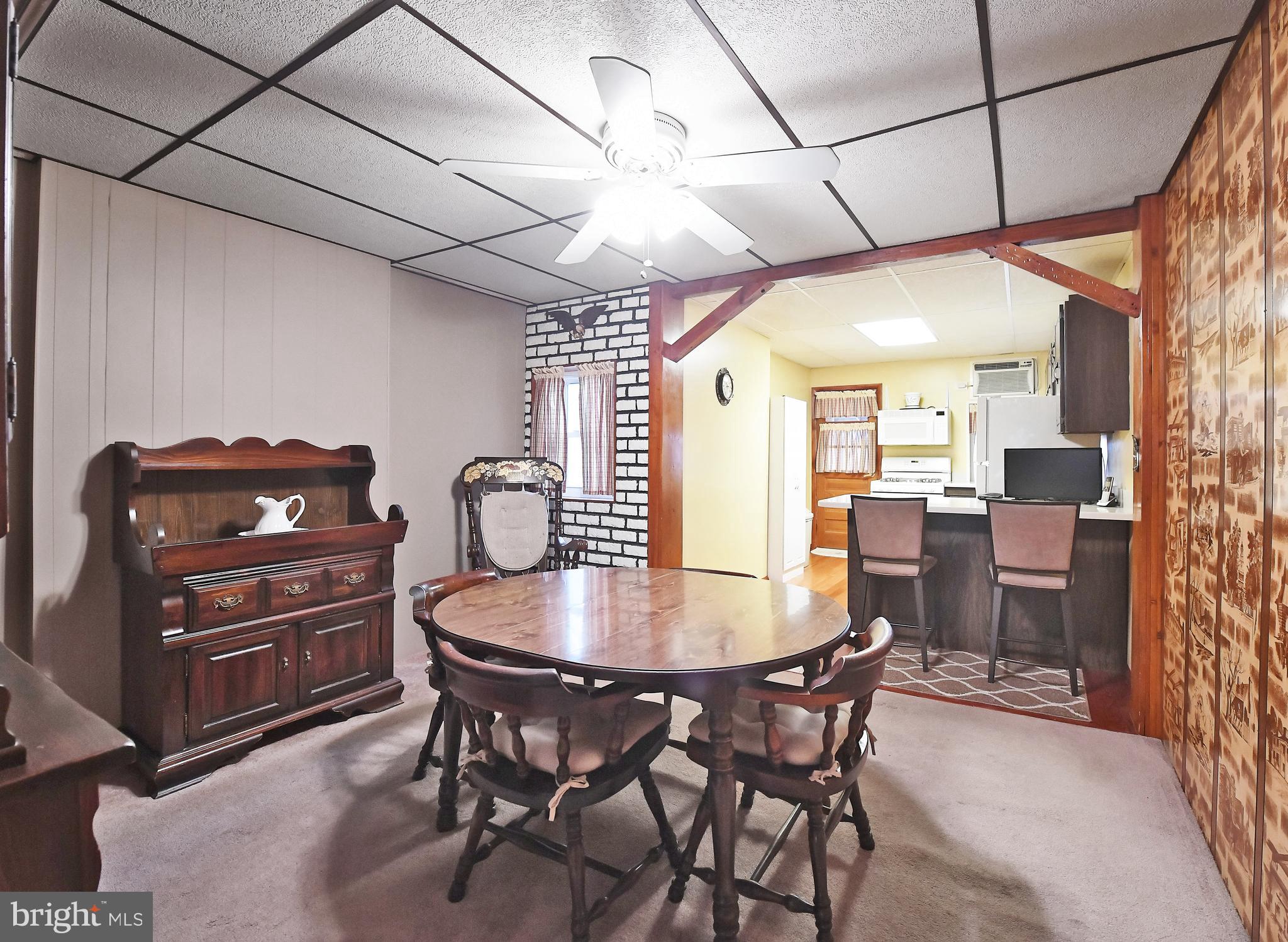 3516 Roland Avenue Baltimore, MD 21211 - Photo 10 of 23 Wood beam accent between dining & kitchen