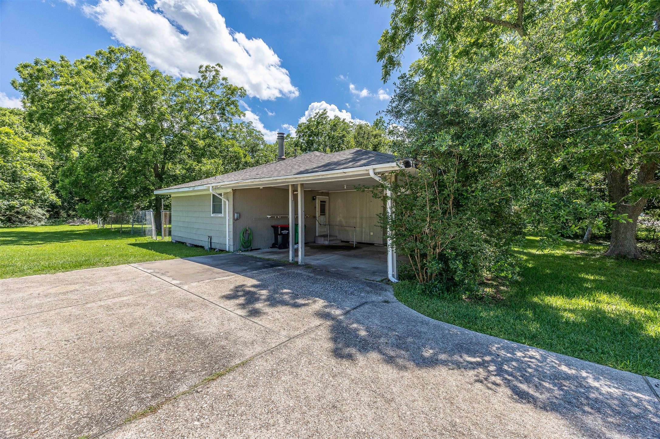 502 Massey Tompkins Road Baytown, TX 77521 - Photo 23 of 32 a view of a house with backyard and a garden