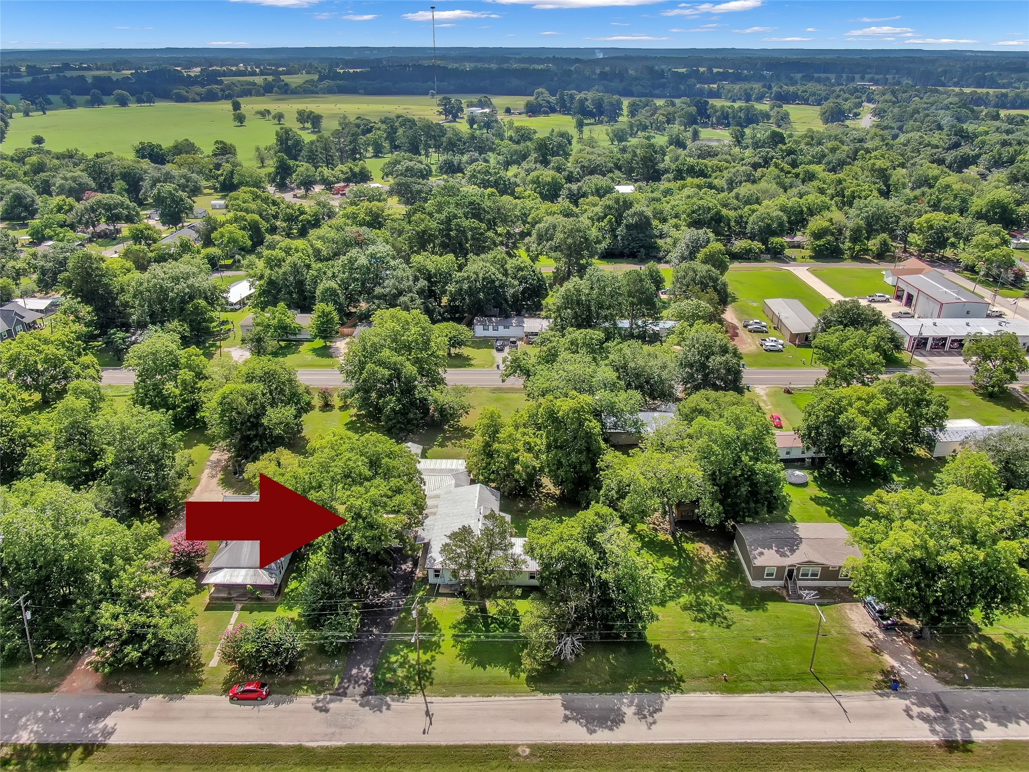 511 East Front Street New Waverly, TX 77358 - Photo 15 of 38 an aerial view of a house with a yard and lake view