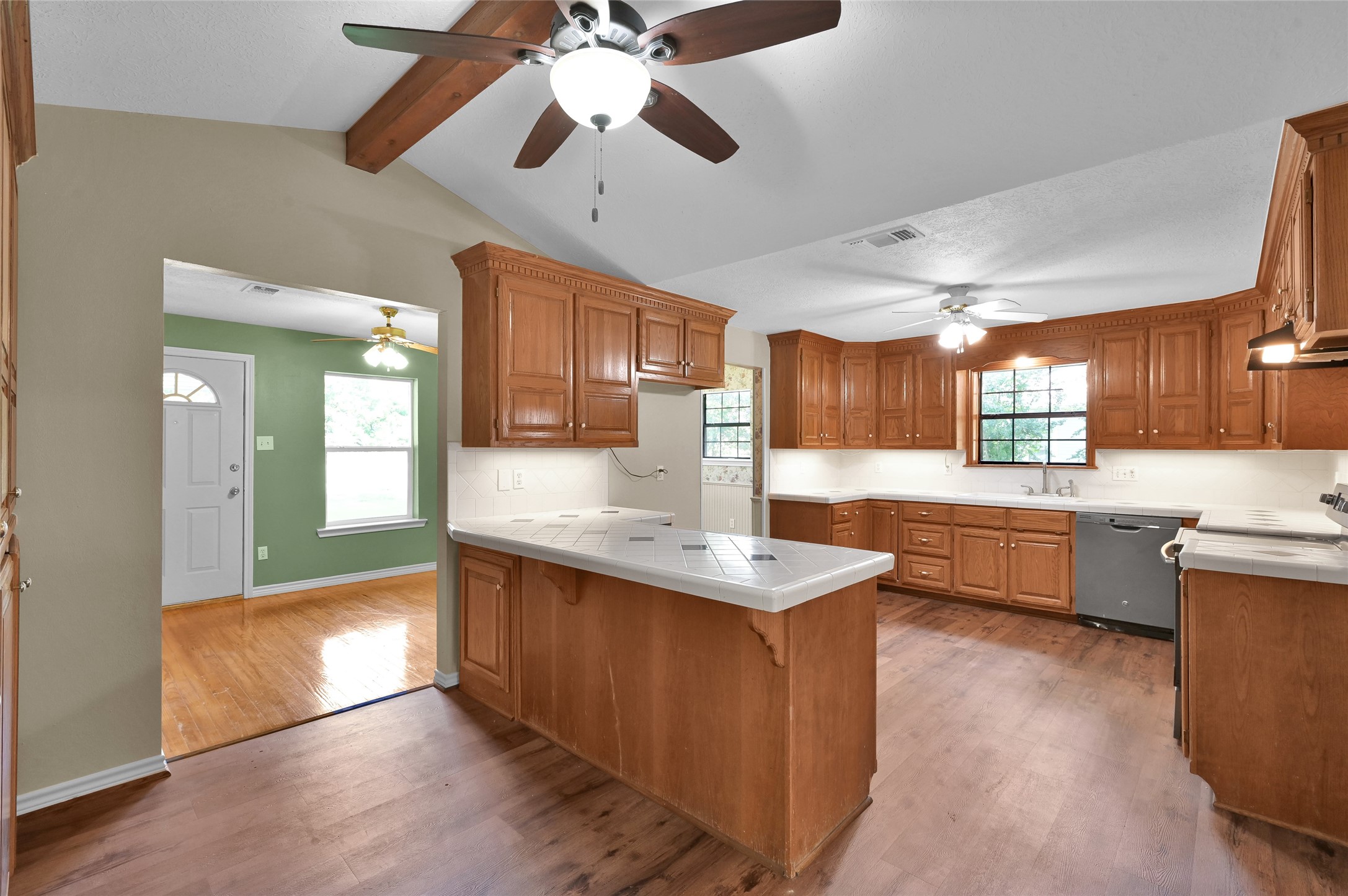 511 East Front Street New Waverly, TX 77358 - Photo 18 of 38 a kitchen with granite countertop a sink cabinets and wooden floor