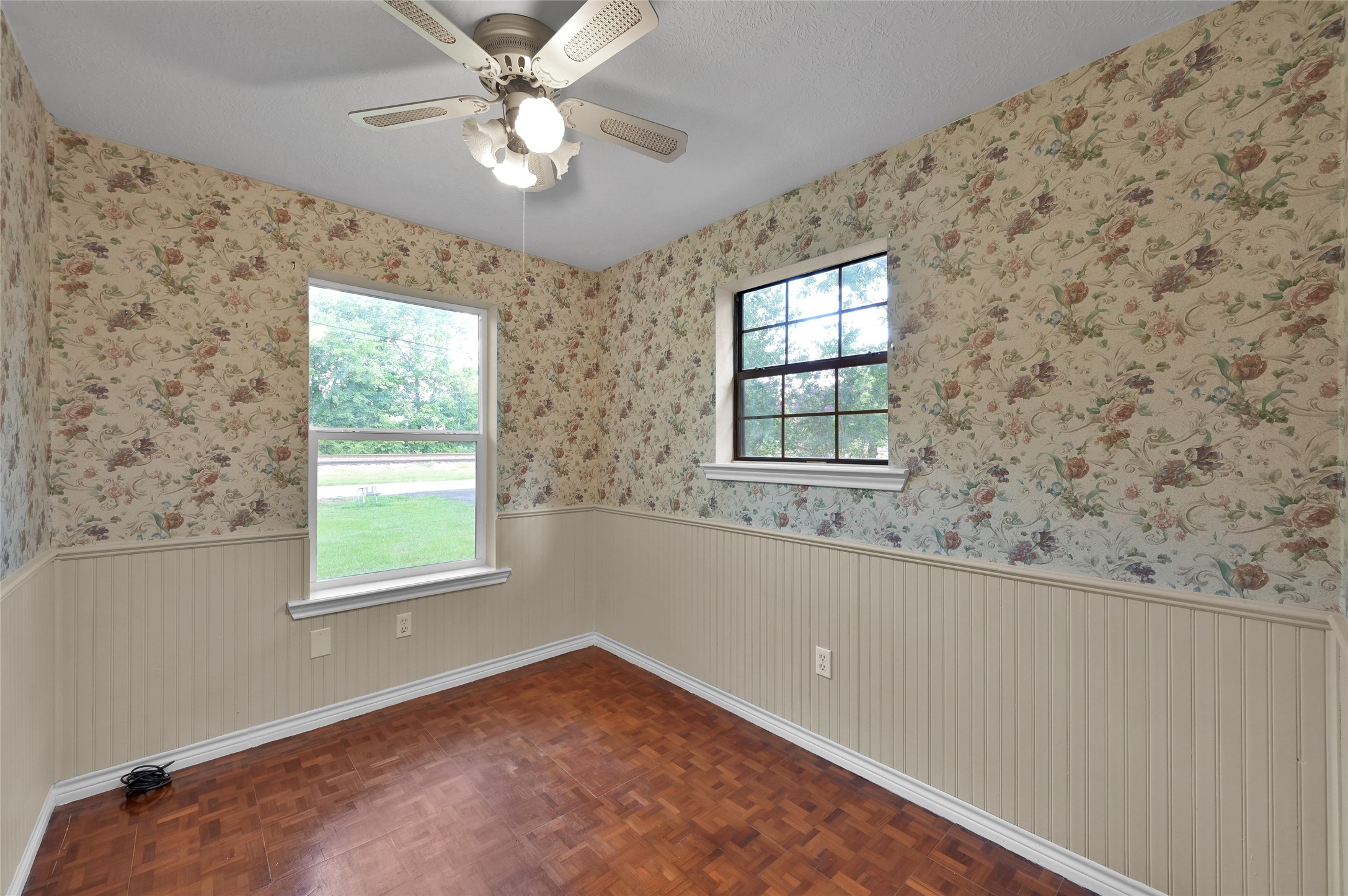 511 East Front Street New Waverly, TX 77358 - Photo 22 of 38 en empty room with windows and ceiling fan