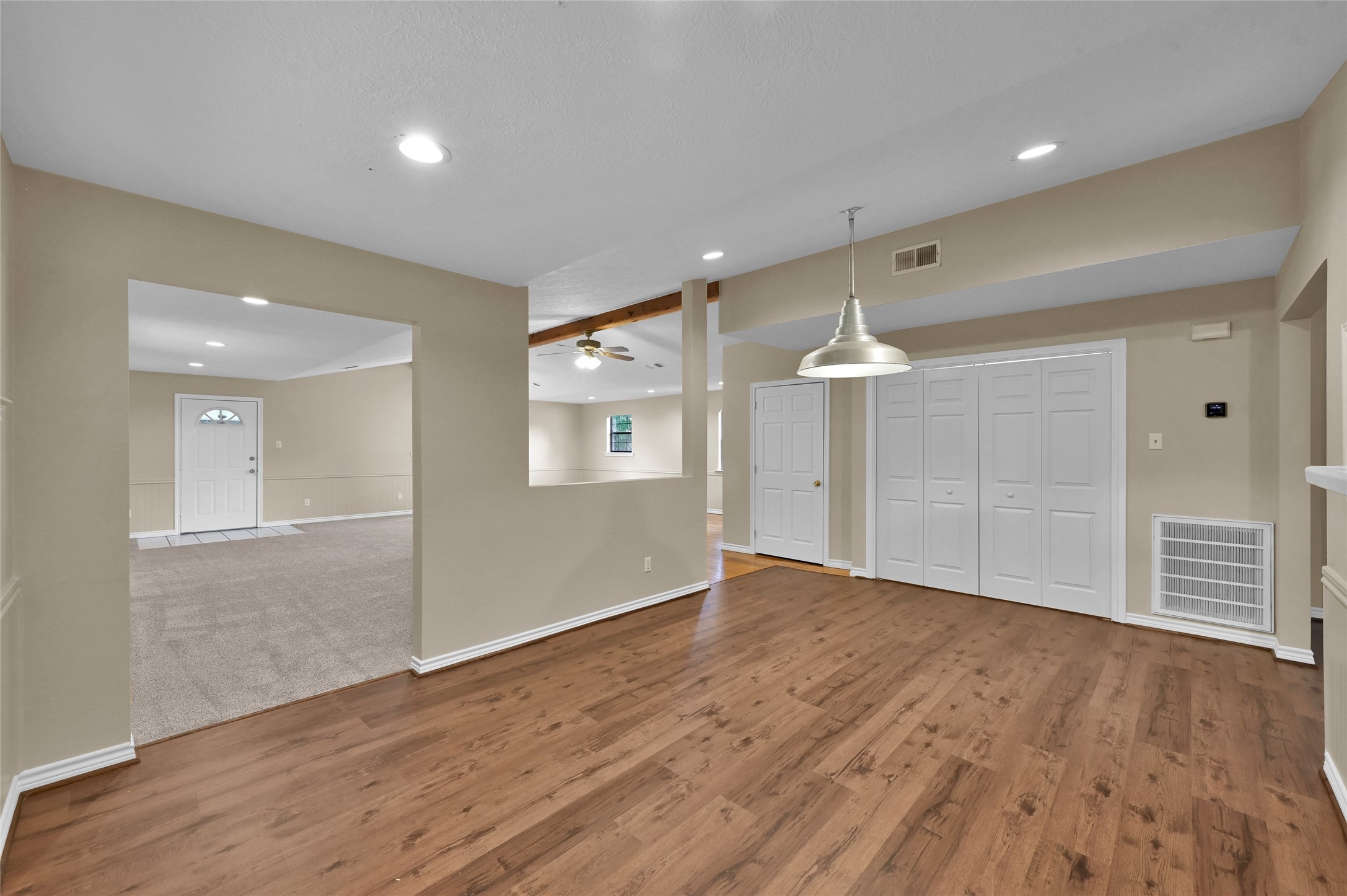 511 East Front Street New Waverly, TX 77358 - Photo 26 of 38 wooden floor in an empty room with a window