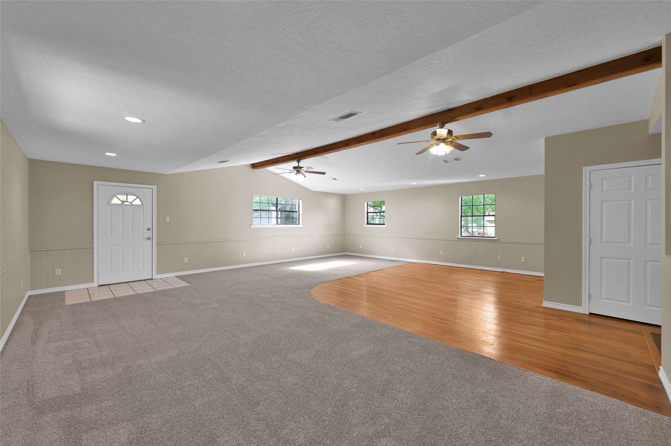 511 East Front Street New Waverly, TX 77358 - Photo 33 of 38 an empty room with wooden floor and windows