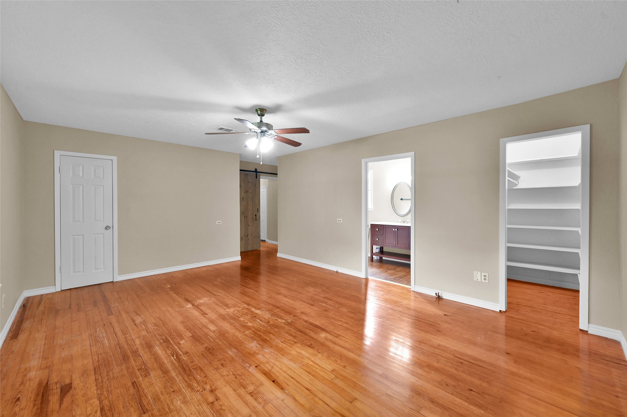 511 East Front Street New Waverly, TX 77358 - Photo 36 of 38 a view of an empty room with a window and wooden floor