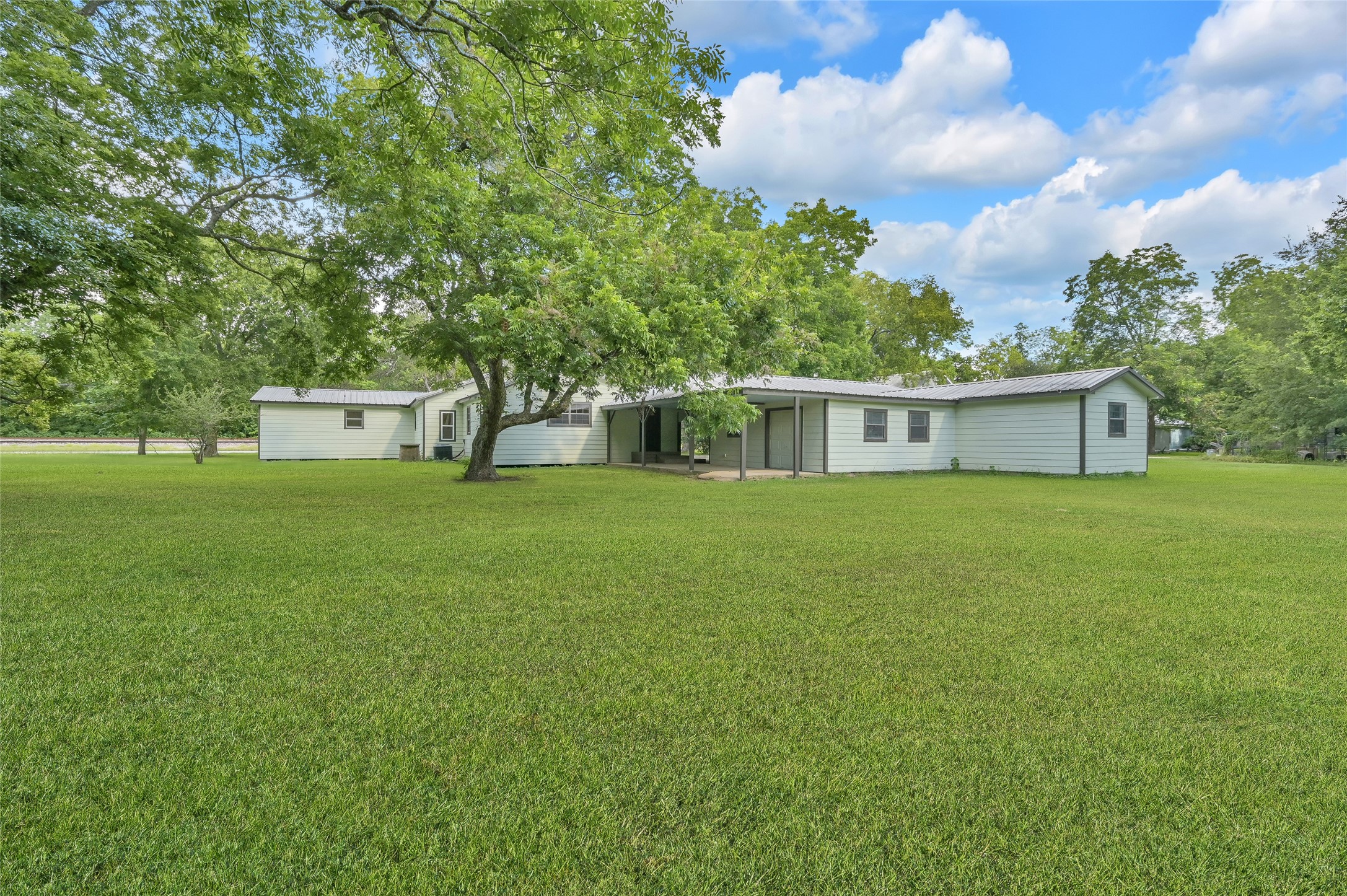 511 East Front Street New Waverly, TX 77358 - Photo 6 of 38 a view of a house with a yard