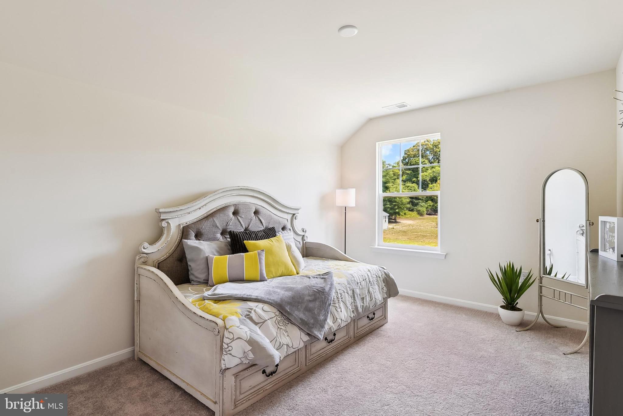 26571 Line Road Seaford, DE 19973 - Photo 22 of 26 a bedroom with a bed and a window