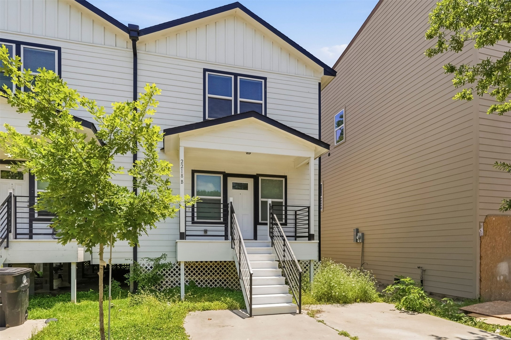 2218 Bringhurst Street, Unit B Houston, TX 77026 - Photo 2 of 25 a front view of a house with garden