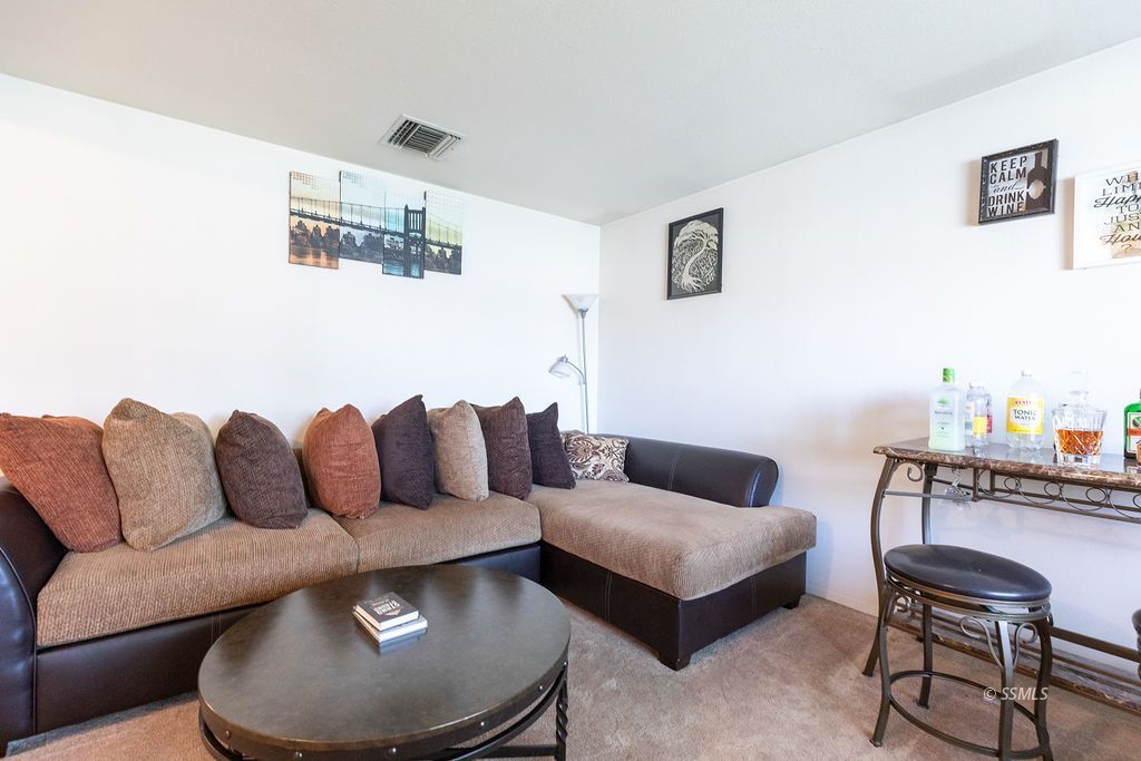 324 East Upjohn Avenue Ridgecrest, CA 93555 - Photo 6 of 35 a living room with furniture and a couch