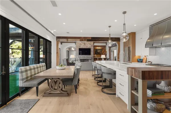 a living room with furniture flat screen tv and a fireplace