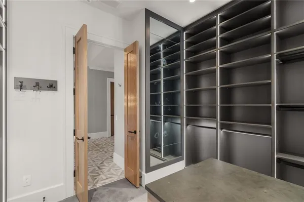 a room with a bed and cabinet