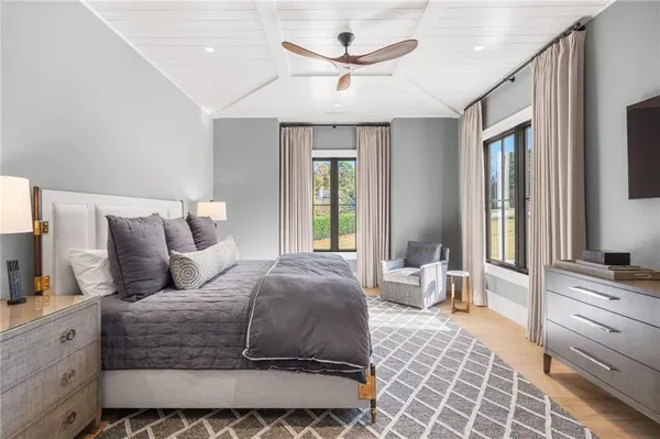 a view of a livingroom with a ceiling fan and window