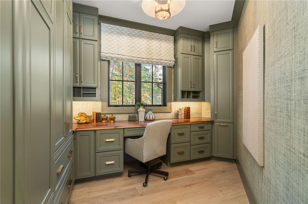 6091 GC Crow Road Flowery Branch, GA 30542 - Photo 52 of 100 a view of a workspace with furniture and a window
