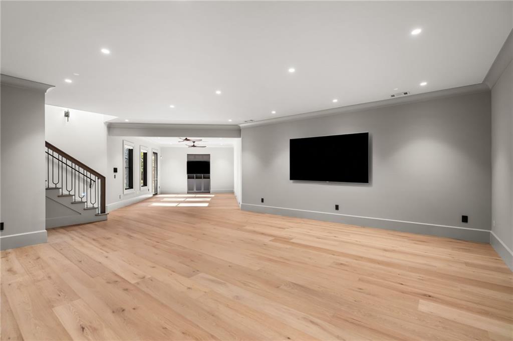 6091 GC Crow Road Flowery Branch, GA 30542 - Photo 64 of 100 a view of an empty room with wooden floor and windows