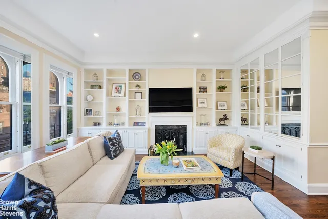 a living room with furniture fireplace and a flat screen tv