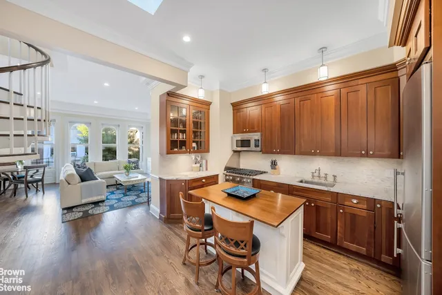 a kitchen that has a table and chairs in it