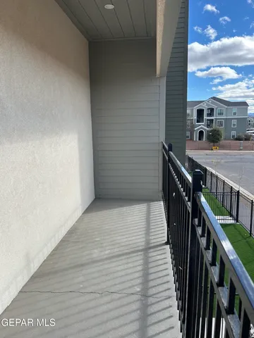 a view of balcony with wooden floor