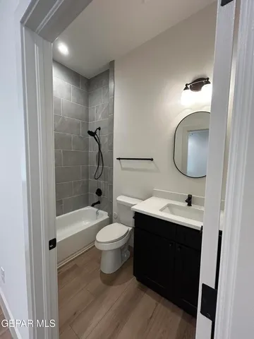 a bathroom with a sink toilet a shower and a mirror