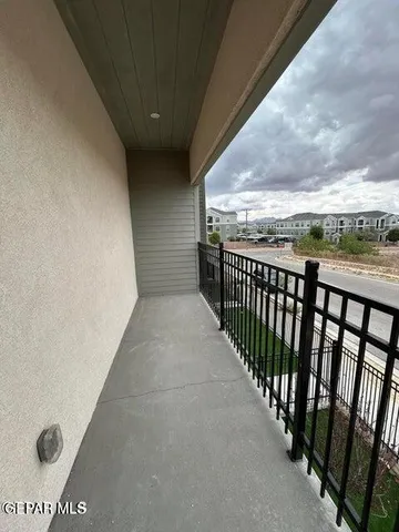 a view of a balcony with an outdoor space