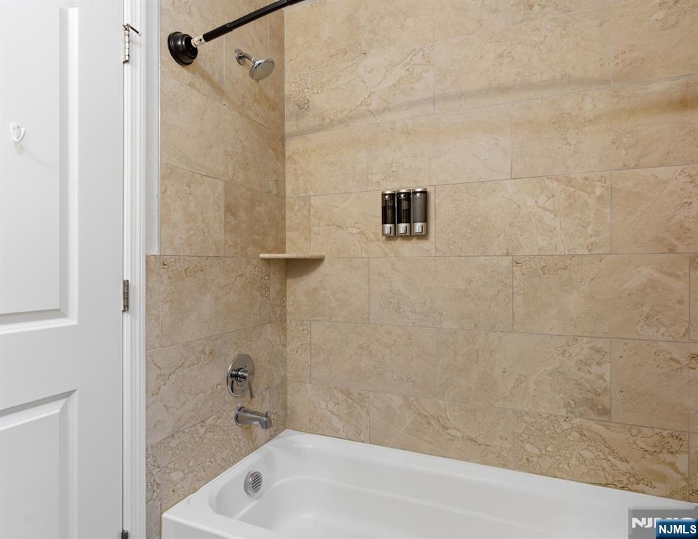 944 Flora Street Elizabeth, NJ 07201 - Photo 22 of 37 a bathroom with a bathtub