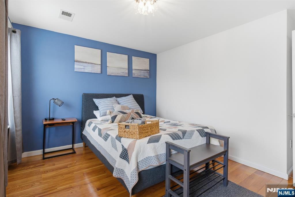 944 Flora Street Elizabeth, NJ 07201 - Photo 24 of 37 a bed sitting in a bedroom next to a larger window