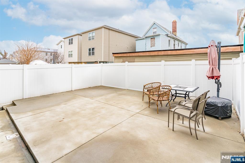 944 Flora Street Elizabeth, NJ 07201 - Photo 34 of 37 a view of a chairs and table on the wall