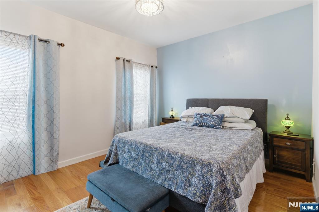 944 Flora Street Elizabeth, NJ 07201 - Photo 8 of 37 a bedroom with a bed and wooden floor