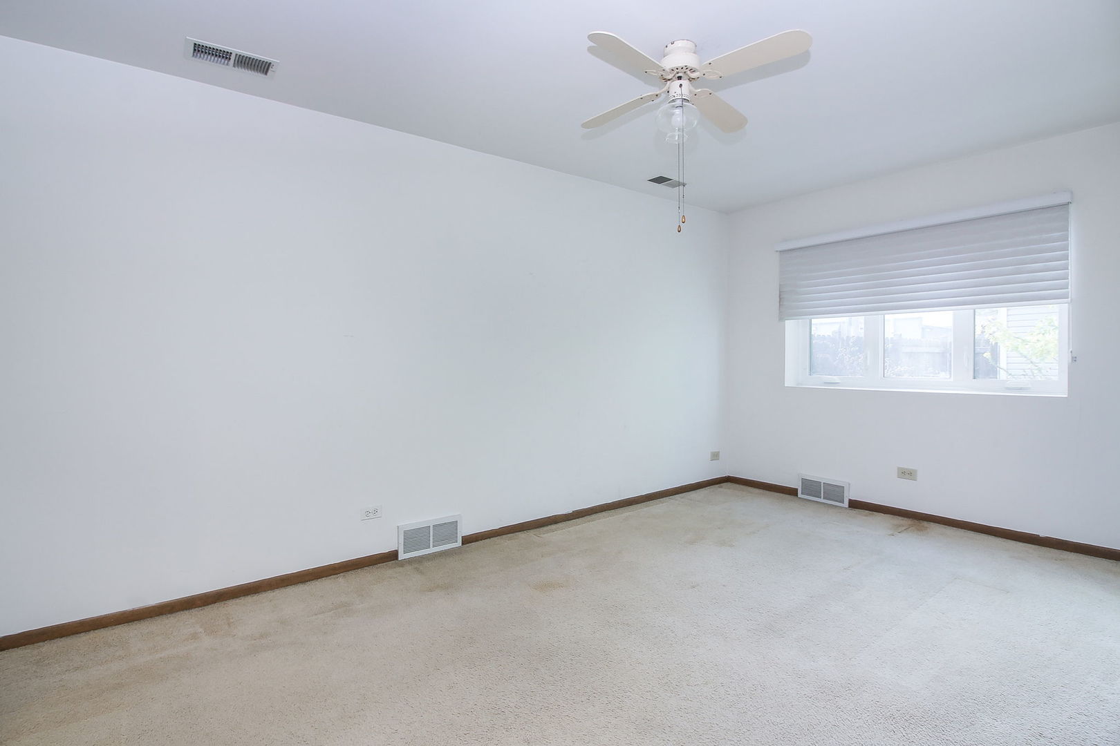 3848 Harrison Avenue Brookfield, IL 60513 - Photo 9 of 12 an empty room with a fan & a window