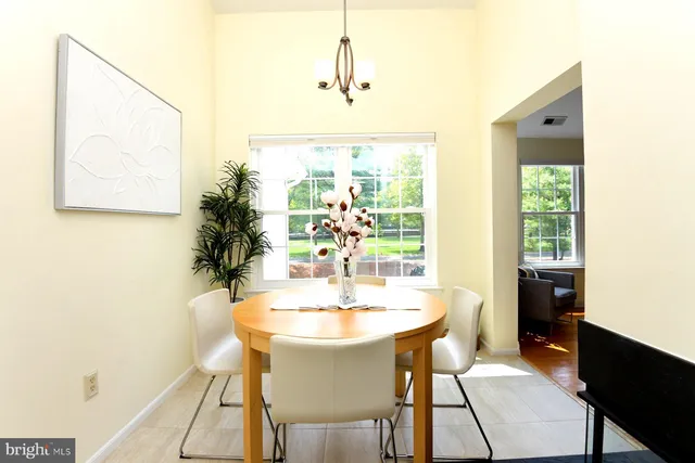 a dining room with a table and chairs